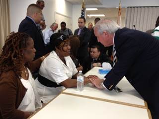 Mayor Carlos A. Gimenez joins victims' families in seeking assistance from the community